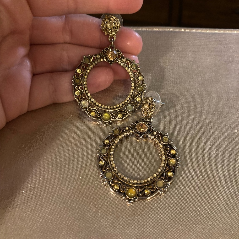 small circular gold and green earrings